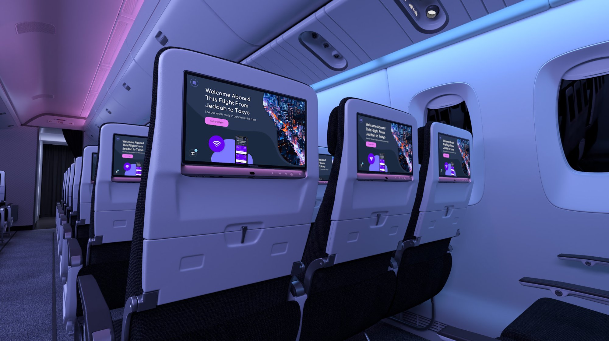 Airplane cabin with rows of economy seats, each with a touchscreen showing a welcome message