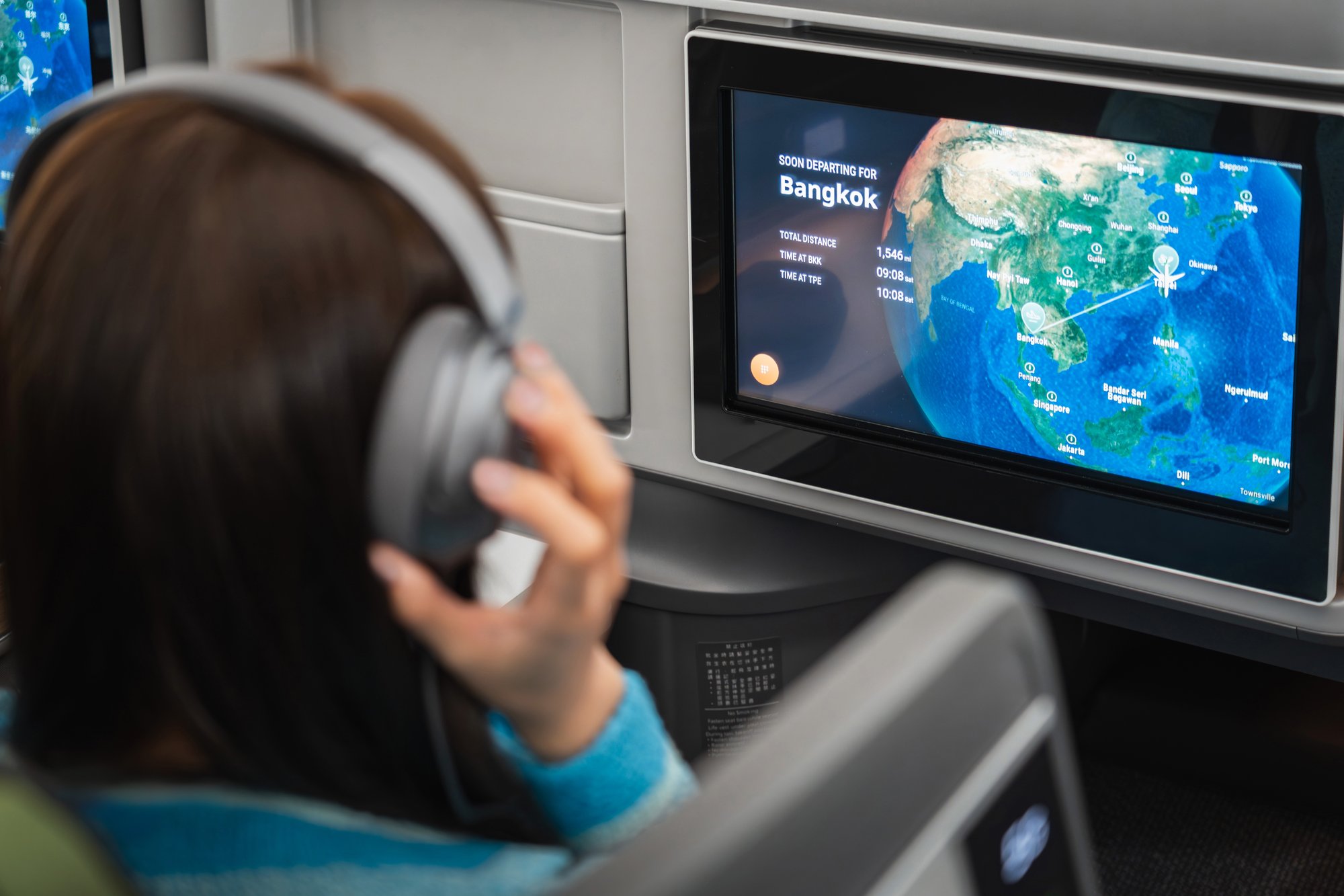 Passenger watching Panasonic Avionics Arc map