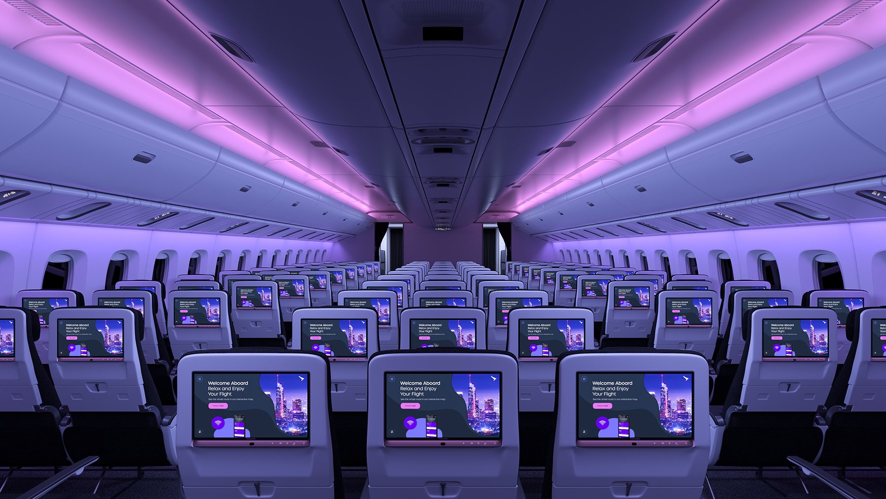 Multiple Astrova screens on economy seatbacks in a cabin at night