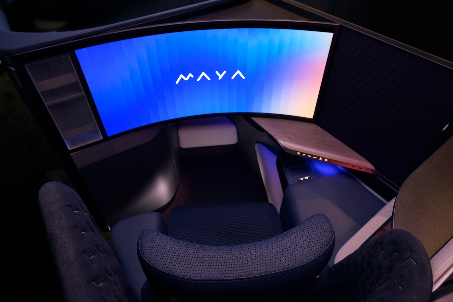 MAYA seat with the word MAYA displayed on the curved screen