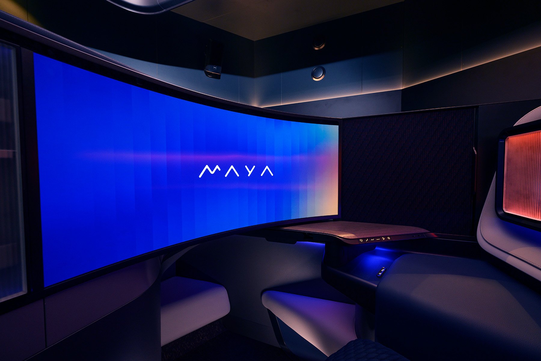 Close-up view of the MAYA seat with the word MAYA displayed on the curved screen