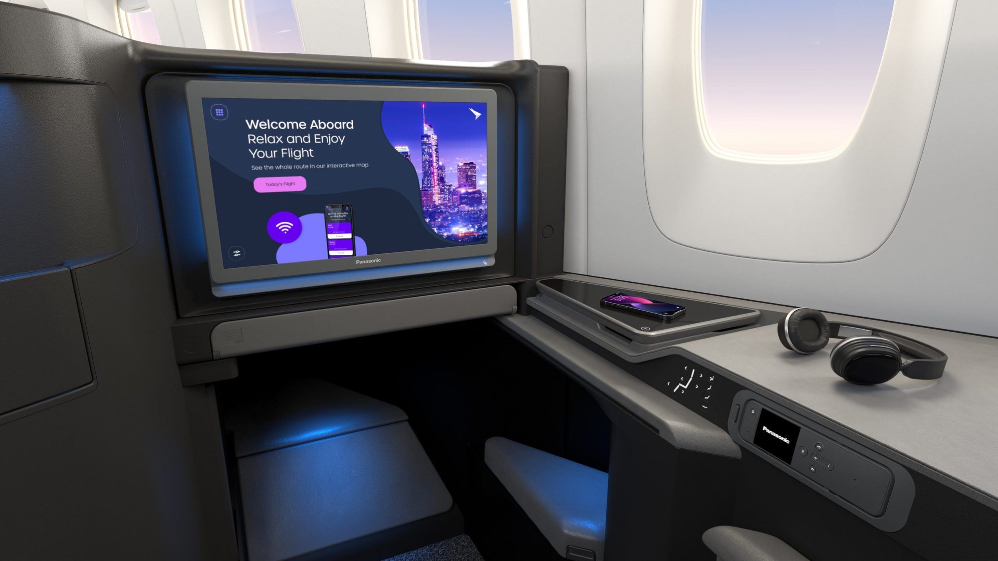First-class airplane seat with an in-flight entertainment, side table with a smartphone, and headphones
